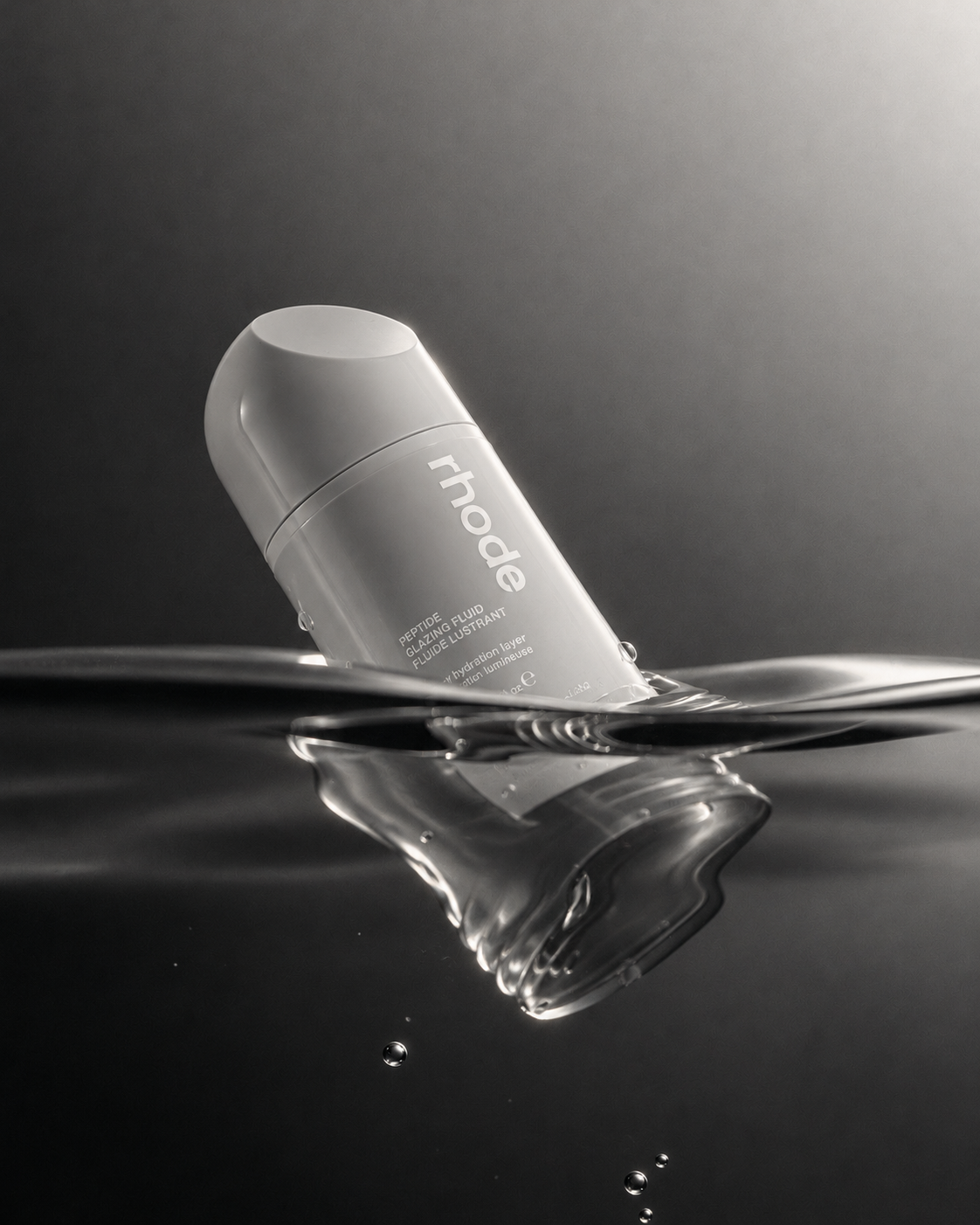 In water direction — the same skincare fluid bottle